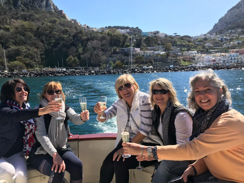 Valise travelers on a boat on the Amalfi Coast