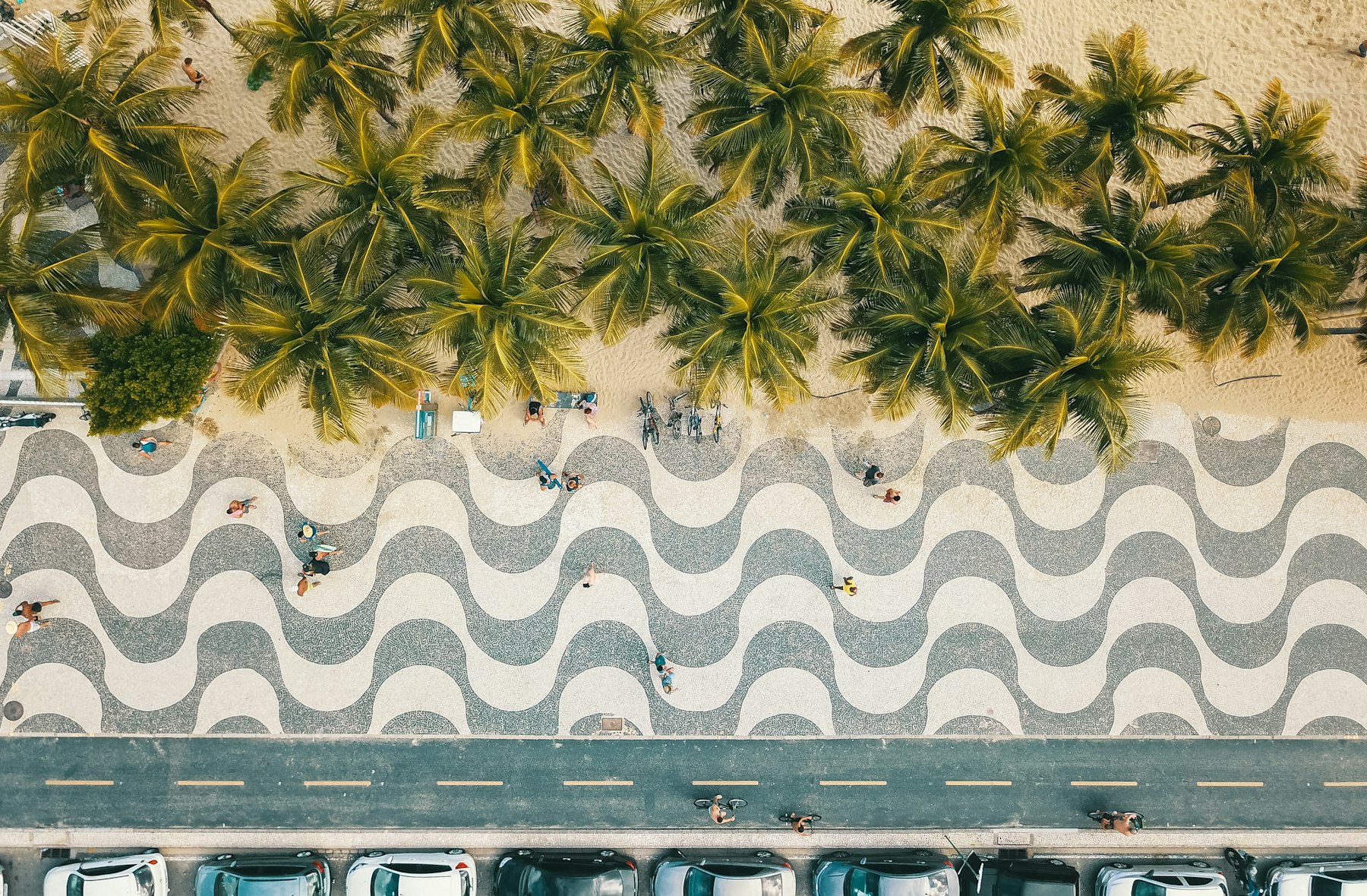 Aerial view of the wave-pattern Copacabana promenade and palm trees in Rio de Janeiro