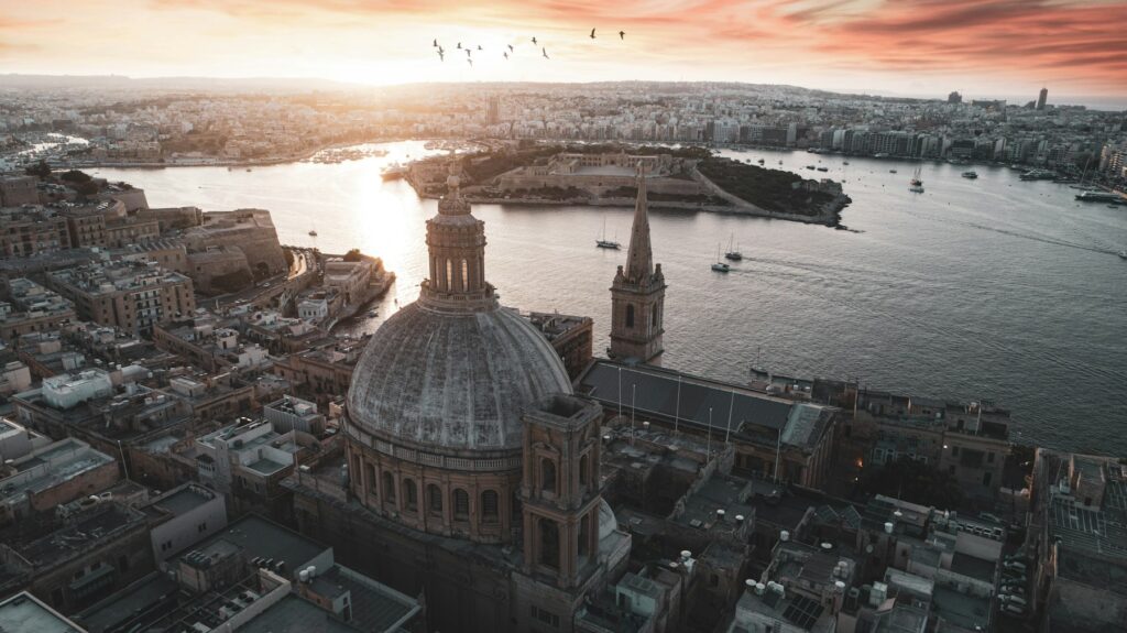 Valletta’s Carmelite dome and Grand Harbour at sunset, Malta