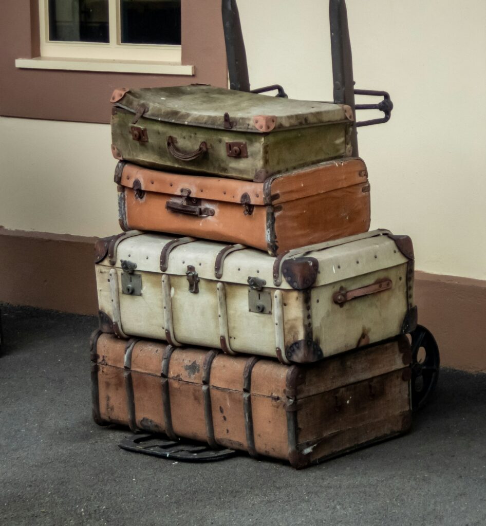 A stack of vintage leather suitcases in soft light